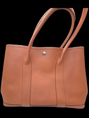 Hermès Garden Party PM tote bag in orange Negonda leather with silver hardware.